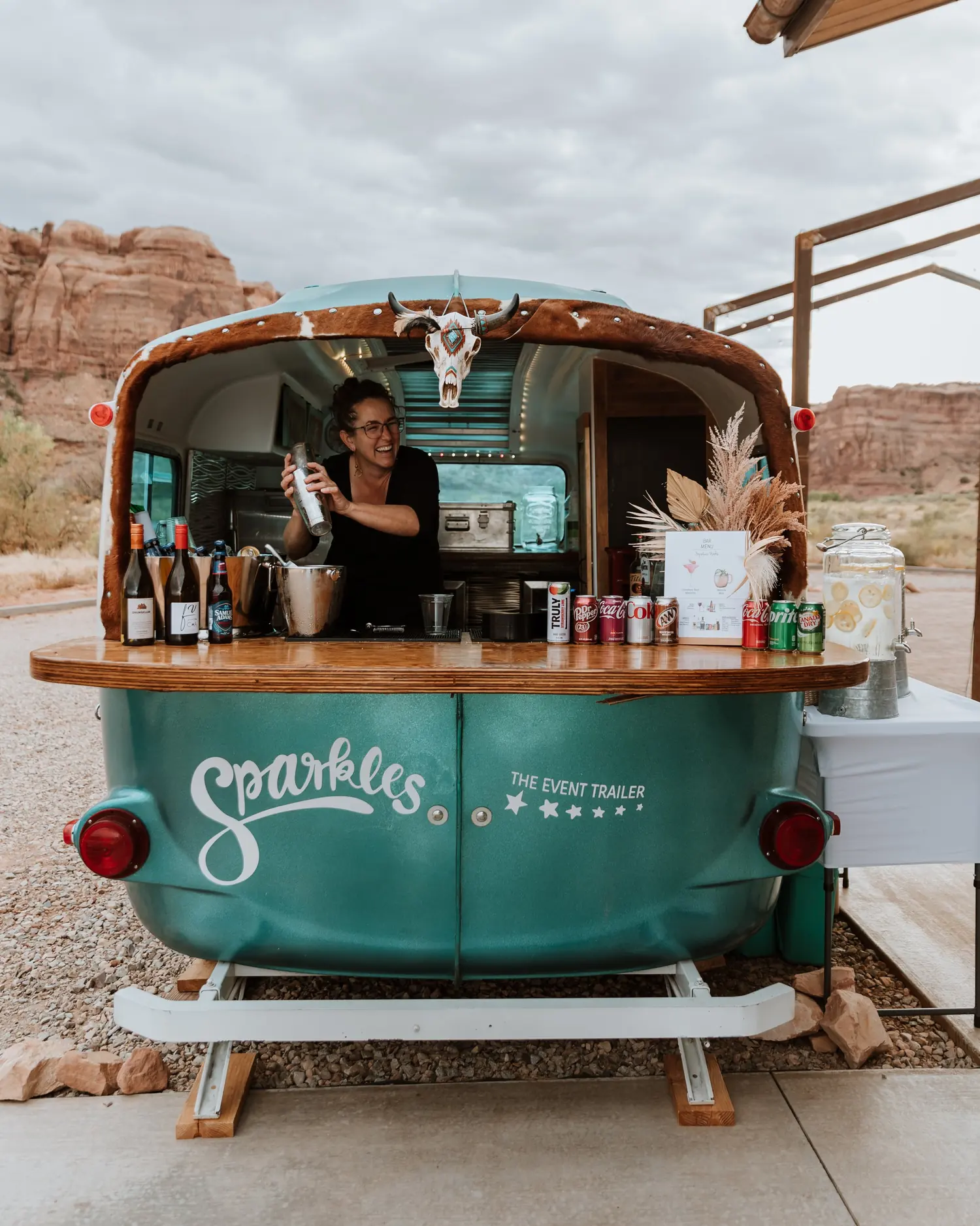 Moab Bar Trailers' vintage Sparkles bar trailer set up for an outdoor event in the Moab desert
